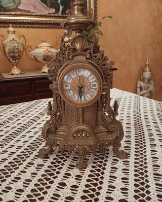 tris candelabri e orologio 
