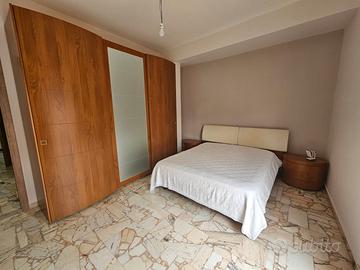 Camera da letto in legno completa