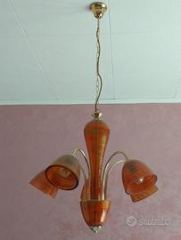 Lampadario color oro e rosso in vetro di murano