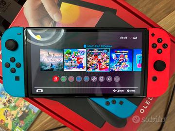 Nintendo Switch OLED + 3 Top Giochi