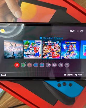 Nintendo Switch OLED + 3 Top Giochi