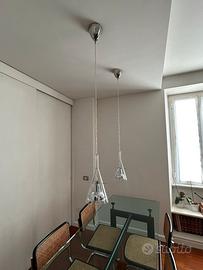 FontanaArte. Lampade flute a sospensione