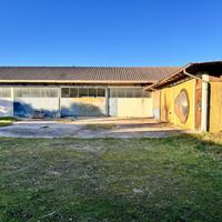 AMPIO CAPANNONE CON TERRENO EDIFICABILE ADIACENTE