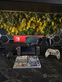 nintendo switch con pokemon, controller e altro