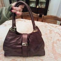 Borsa Coccinelle busta pochette zaino melanzana