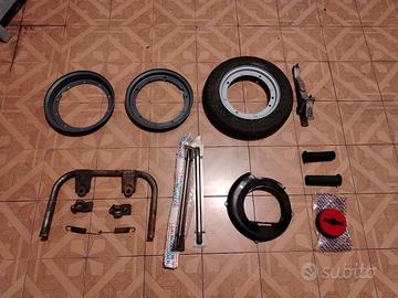 PEZZI VESPA:PORTA CERCHIO COPRI VOLANO CARBONIO ec