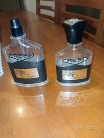 Due bottigliette vuote di profumo Creed