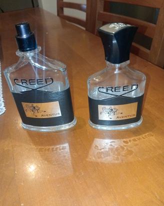 Due bottigliette vuote di profumo Creed