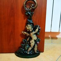 Fermaporta in ghisa con cherubino