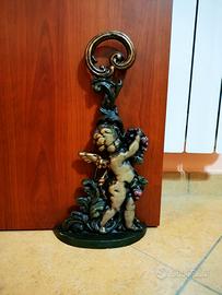 Fermaporta in ghisa con cherubino