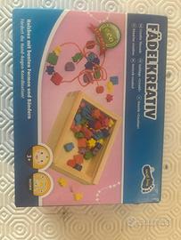 Gioco in legno  per creare collane o braccialetti
