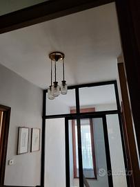 due lampadari anni 60 vetro con bordi gialli