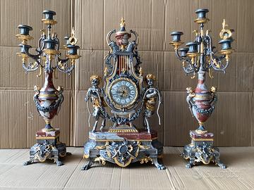 Trittico orologio e Candelabri oro argento 