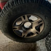 Cerchi e gomme in lega scampanati