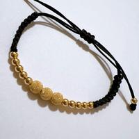 Bracciale marinara in stoffa e sfere oro 18kt 750