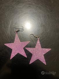 Orecchini a stella viola brillantinati