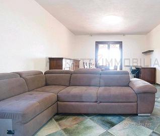 Divano-letto a L in tessuto 