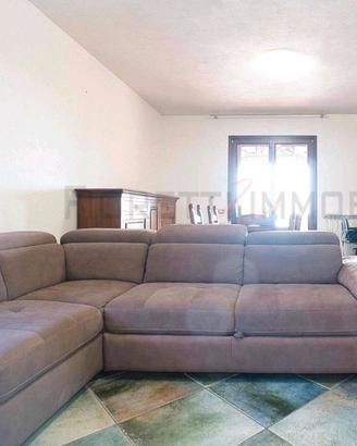 Divano-letto a L in tessuto 
