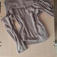 maglione con spalle scoperte