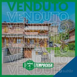 Villetta a schiera di testa con giardino
