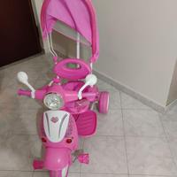 Triciclo bimba rosa con cappottina e maniglione