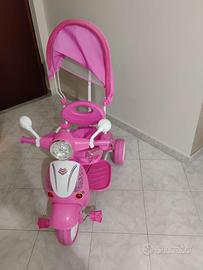 Triciclo bimba rosa con cappottina e maniglione