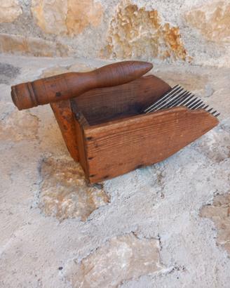 Antico raccoglitore per mirtilli
