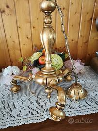 Lampadario il legno dorato