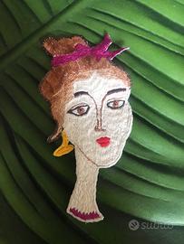 Toppa ricamata a mano