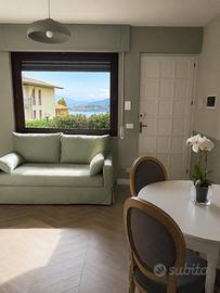 Appartamento vista lago con giardino privato