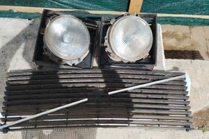 Fari tondi e mascherina Volvo 244/245 
