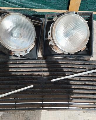 Fari tondi e mascherina Volvo 244/245 