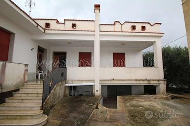 Due unità abitative con veranda terreno e garage