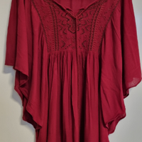 Morbida maglia con maniche a pipistrello marchio O