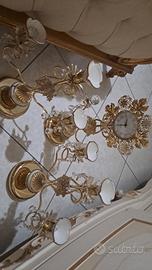 orologio con due candelabri 