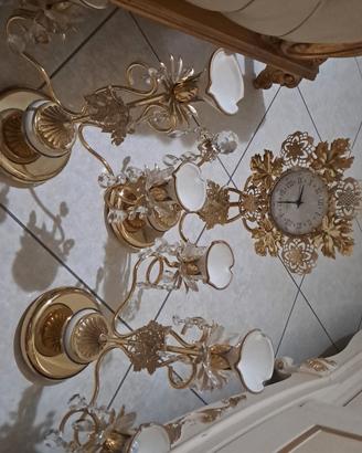 orologio con due candelabri 