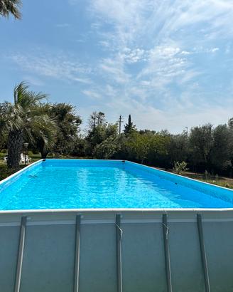 Piscina 975x488 con robot pulizia