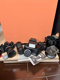 Canon A1 con flah, teleobbiettivi, filtri, borsa