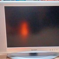 TV color SHARP con telecomando.