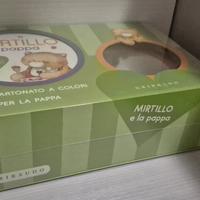 piatto per la pappa e libro cartonato bambino