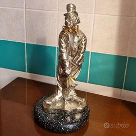 Statuetta clown argentata firmata su base in marmo