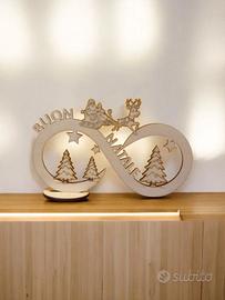 infinito con slitta di babbo natale su legno