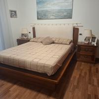 struttura letto in legno massello e copritestiera
