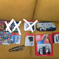 nintendo switch oled, più giochi e accessori