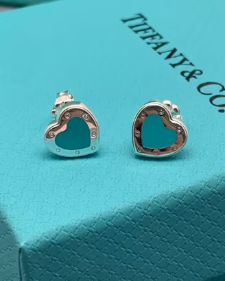 Orecchini Tiffany e anelli Bulgari