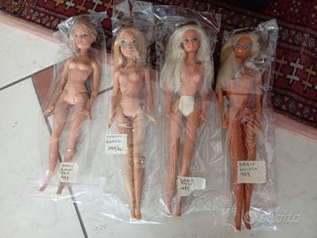 Lotto di 4 Barbie 