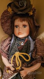 2 bambole in porcellana come da foto