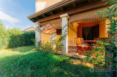 Trilocale al piano terra con giardino e posto auto