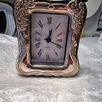 orologio da tavolo con cornice d'argento