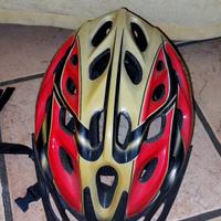 Casco rosso/bisnco  taglia M/L regolabile